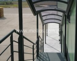 Στέγαστρο Εξωτερικού κλιμακοστασίου με συμπαγές πολυκαρβονικό χρώματος φυμε-γκρι- σχεδιασμός / κατασκευή Taxiarchis Construct τηλ. 2391021335